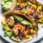 Spicy Shrimp Tacos with Mango Slaw and Avocado Crema